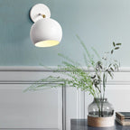 Adjustable Matte Metal Globe Wall Lamp with Brass Pivot Arm | Thrascher