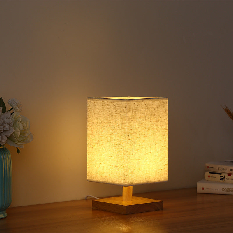 Compact Scandinavian Wooden Foot Table Lamp with Linen Lampshade | Thrascher