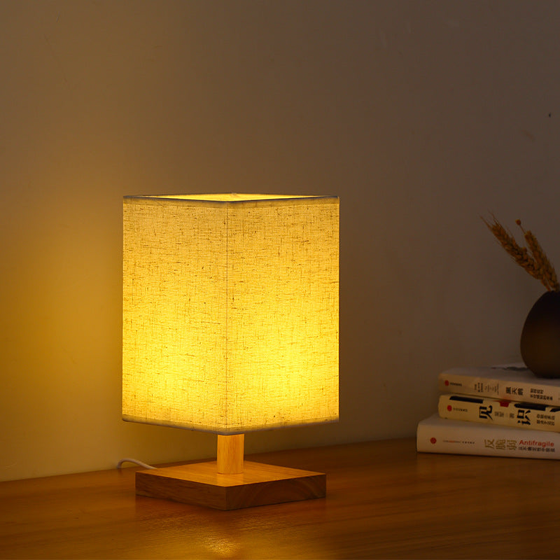Compact Scandinavian Wooden Foot Table Lamp with Linen Lampshade | Thrascher