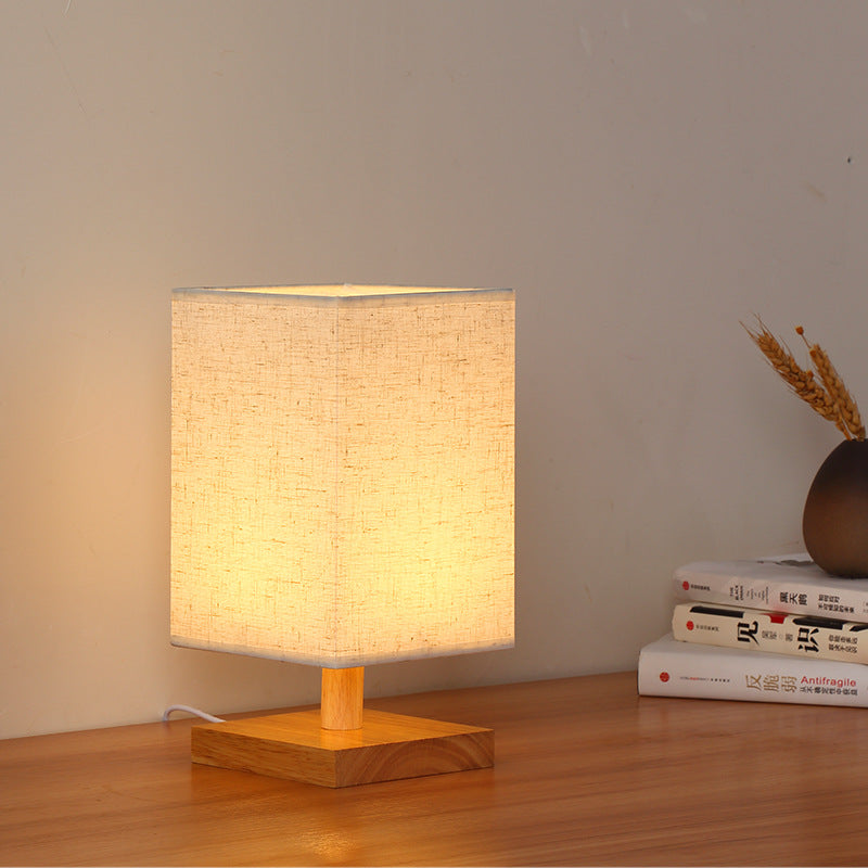 Compact Scandinavian Wooden Foot Table Lamp with Linen Lampshade | Thrascher