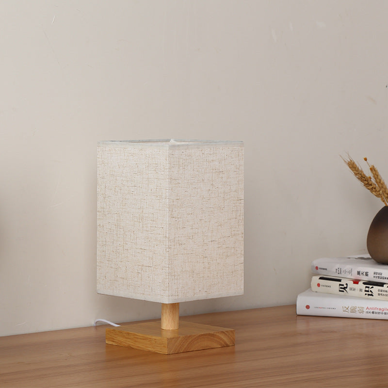 Compact Scandinavian Wooden Foot Table Lamp with Linen Lampshade | Thrascher