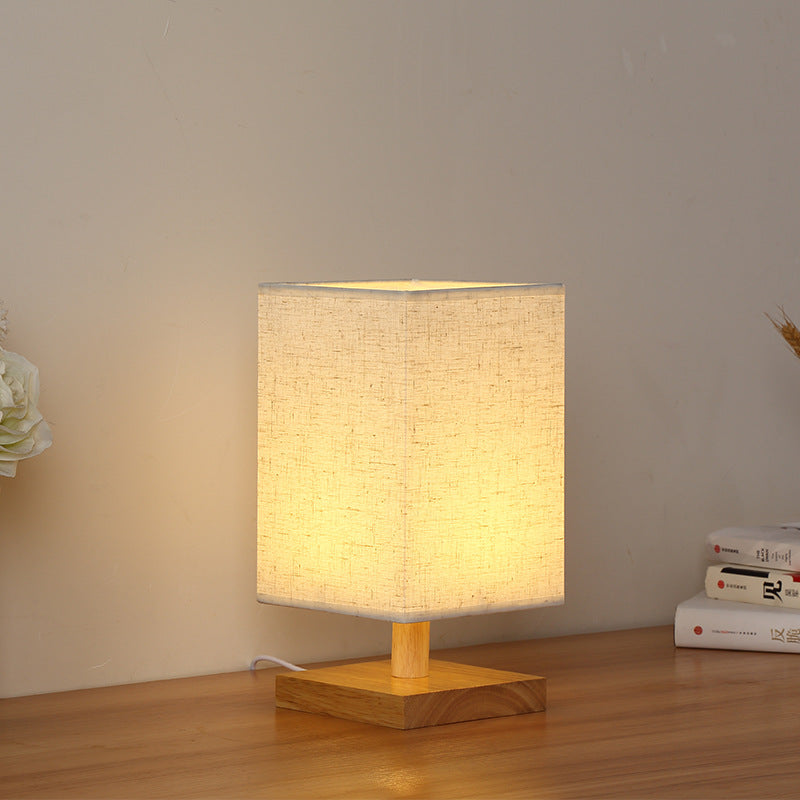 Compact Scandinavian Wooden Foot Table Lamp with Linen Lampshade | Thrascher