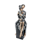 Elegant Sculpture of a Romantic Couple | Thrascher