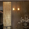 Vertical Brass Dual Glass Cylinder Wall Lamp with Strap Detail | Thrascher